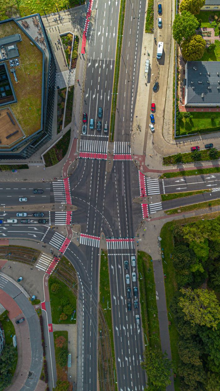 Aerial view of a busy urban intersection in Kraków, Poland, showcasing traffic dynamics.